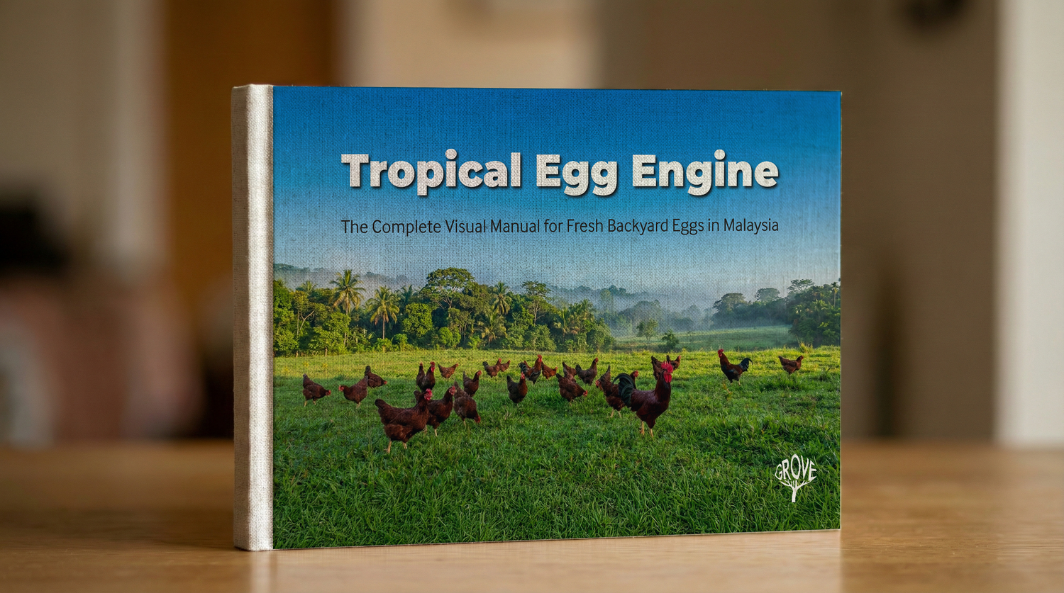 Book titled 'Tropical Egg Engine' on a wooden surface with a blurred background